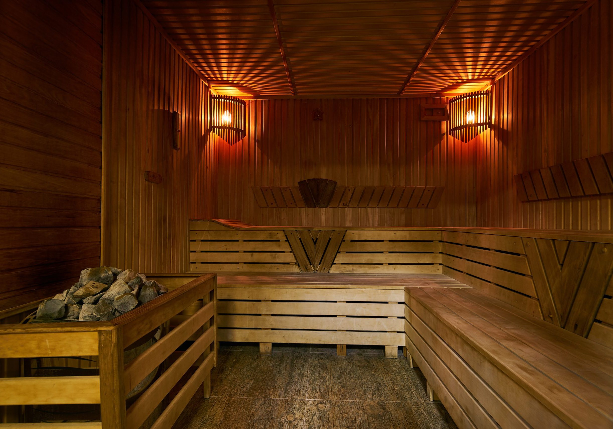 Wooden sauna interior Wooden sauna interior. Relax in a hot small Finnish wooden sauna room in SPA centre